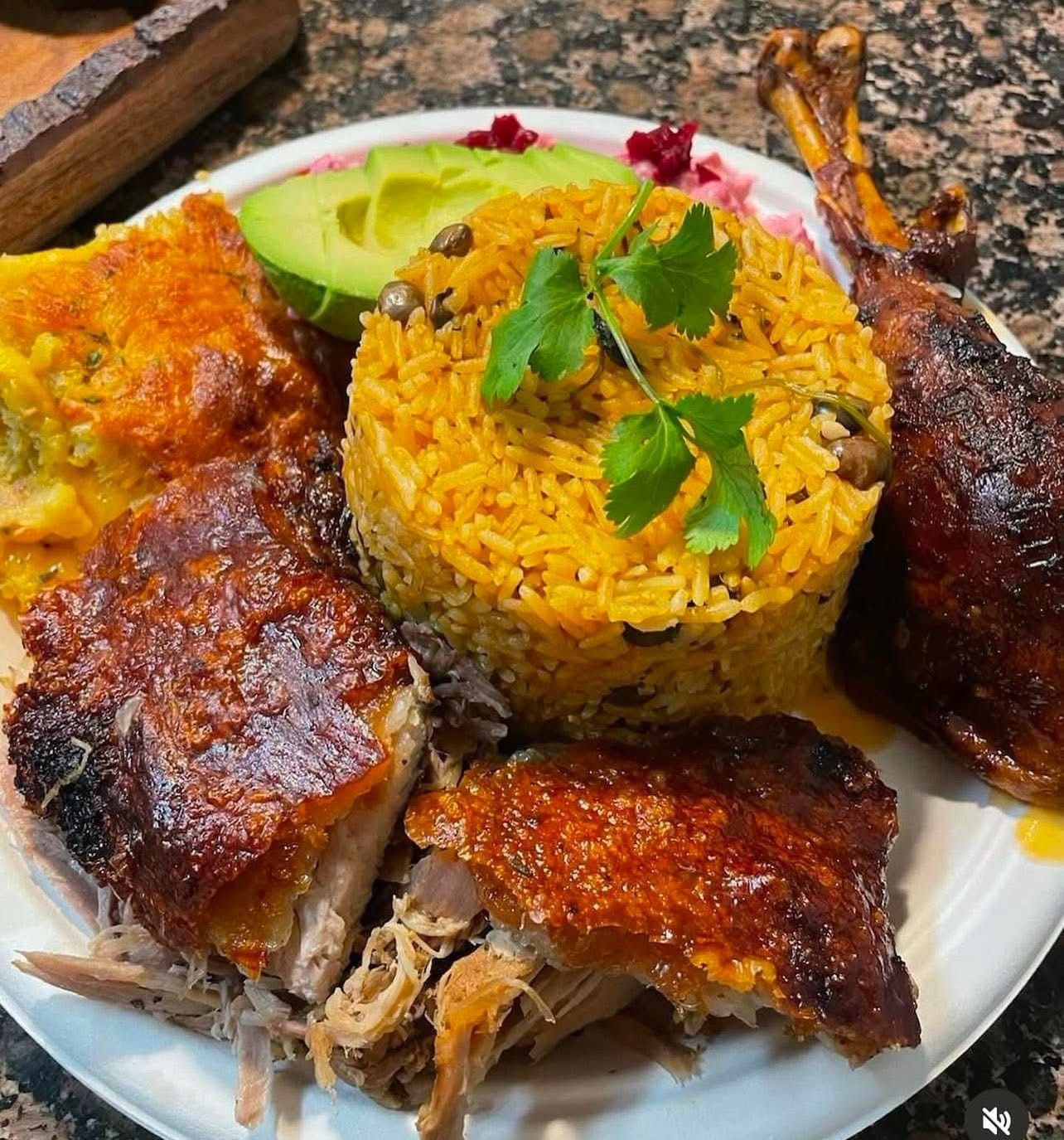 Chef Keisy roast chicken with yellow rice and avocado